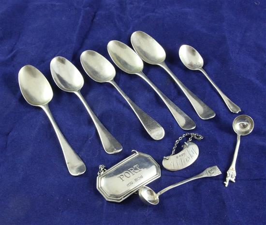 Five Georgian silver tea spoons, (indistinct marks) two later wine labels, two condiment spoons and a coffee spoon, 3 oz.